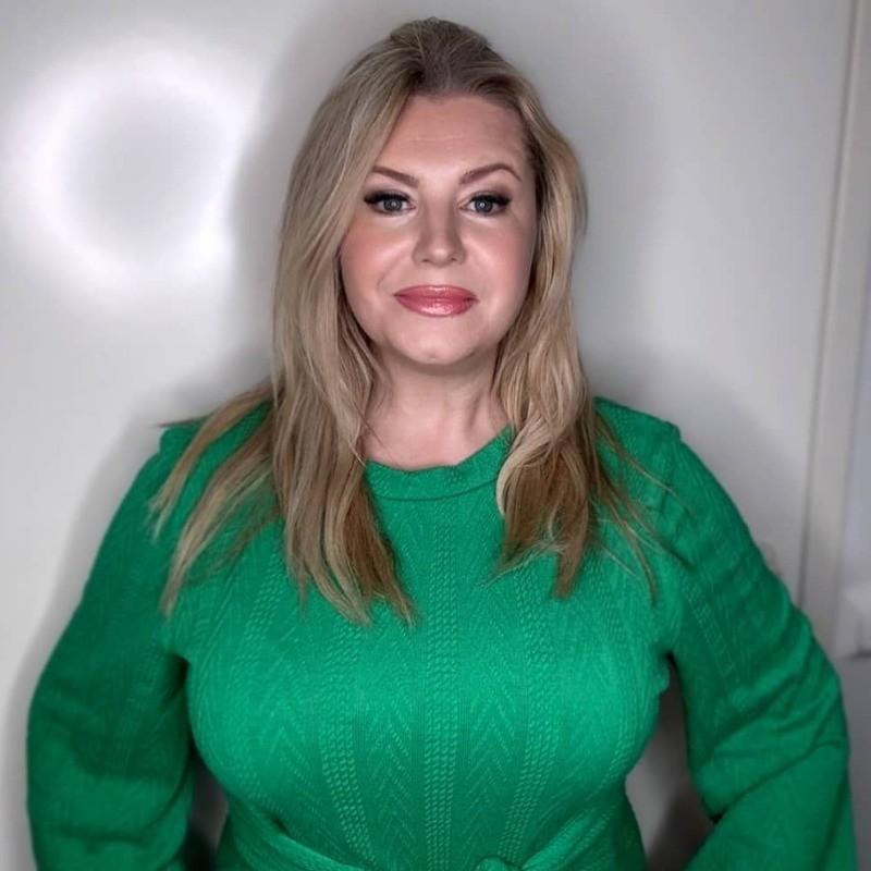 Jenny Rorke, Director of StanDave LLC, smiling professionally